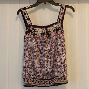 White House Black Market print sleeveless blouse w/ smocked waist. Size S.